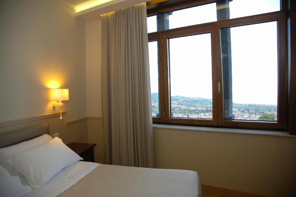 Postel nebo postele na pokoji v ubytování Airone Wellness Hotel