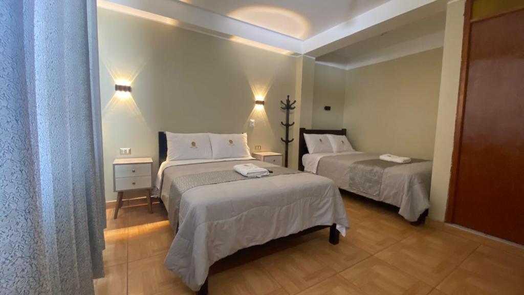 Postel nebo postele na pokoji v ubytování HOTEL MAR Y LAGO