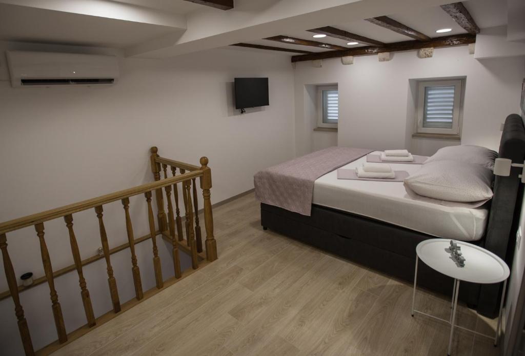 Posteľ alebo postele v izbe v ubytovaní Apartman Mama Marija