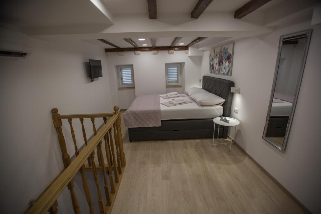 Posteľ alebo postele v izbe v ubytovaní Apartman Mama Marija