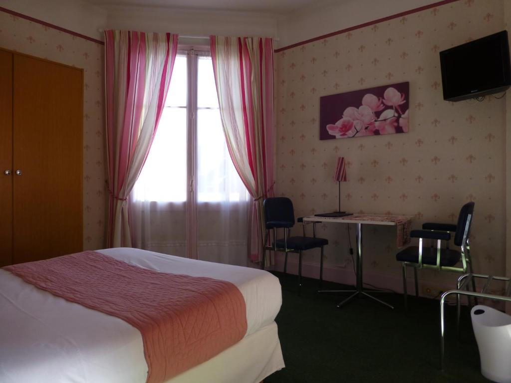 Postel nebo postele na pokoji v ubytování Trianon