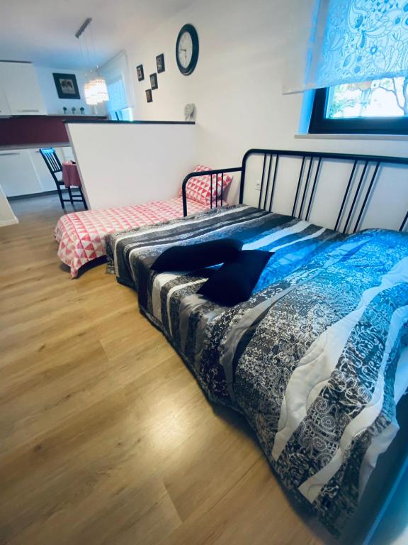 Postel nebo postele na pokoji v ubytování Apartma KAMNITNK