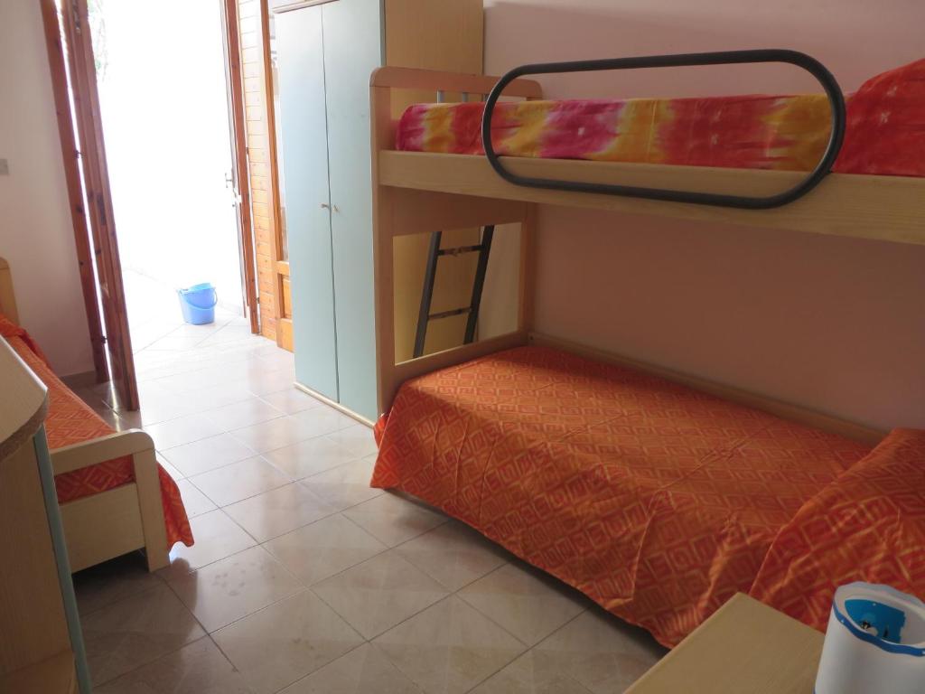 Łóżko lub łóżka w pokoju w obiekcie Rif. 086 e 087 Maldive di SalentoINvacanza.Com