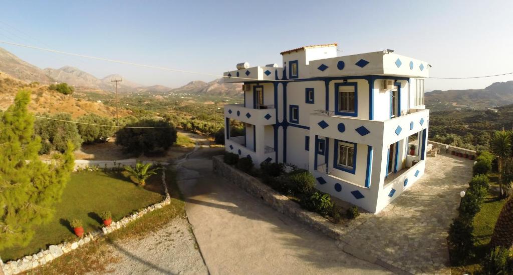 an aerial view of a house with a yard at Galini Apartments in Plakias