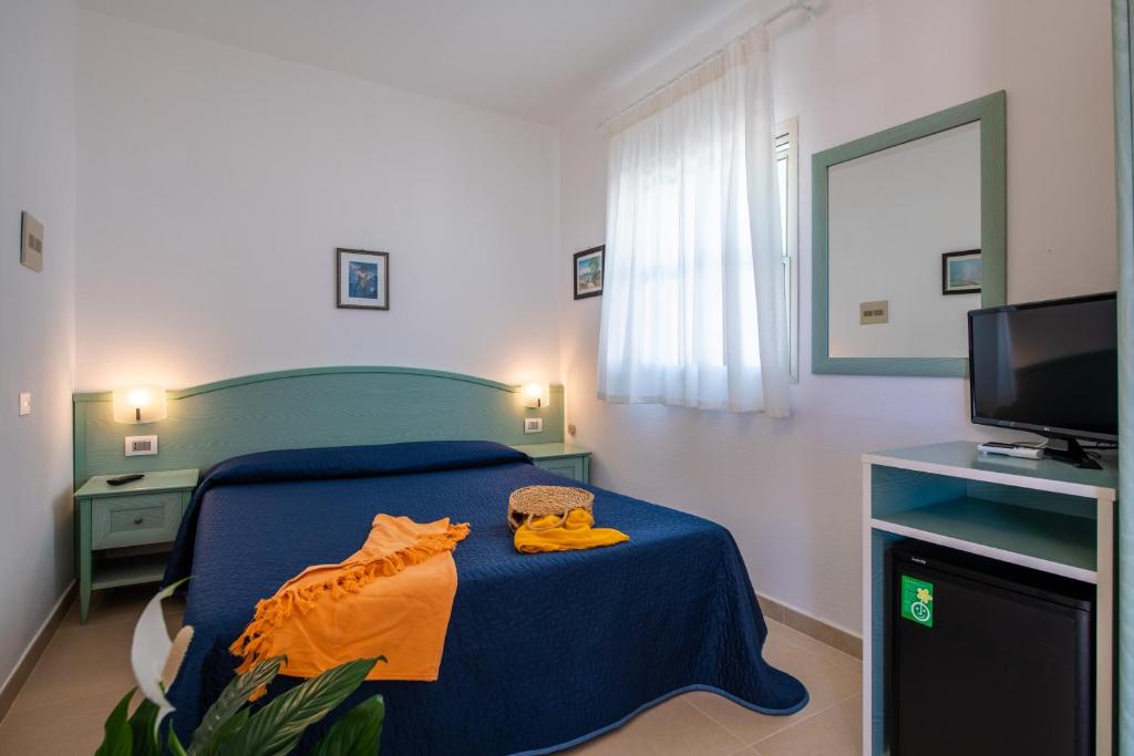 Letto o letti in una camera di Albergo Villa A Mare