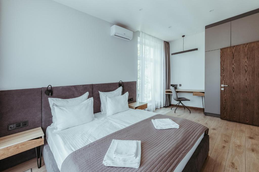 Postel nebo postele na pokoji v ubytování Apartel Shayan