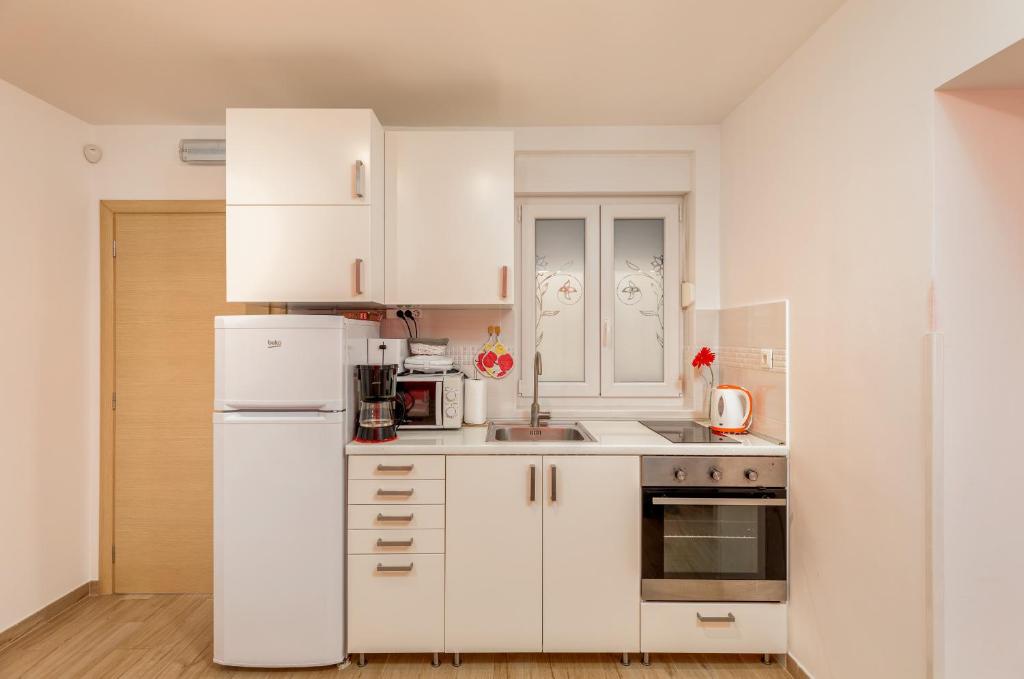 Kuchyň nebo kuchyňský kout v ubytování Apartments Hortensia