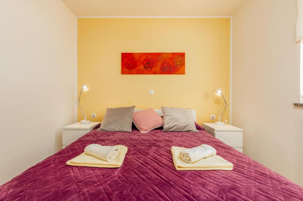 Postel nebo postele na pokoji v ubytování Apartments Hortensia
