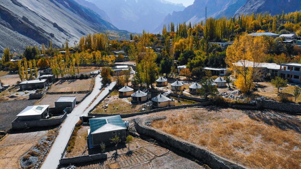 an aerial view of a village in the mountains at Roomy Yurts, Gulmit Hunza in Gulmit