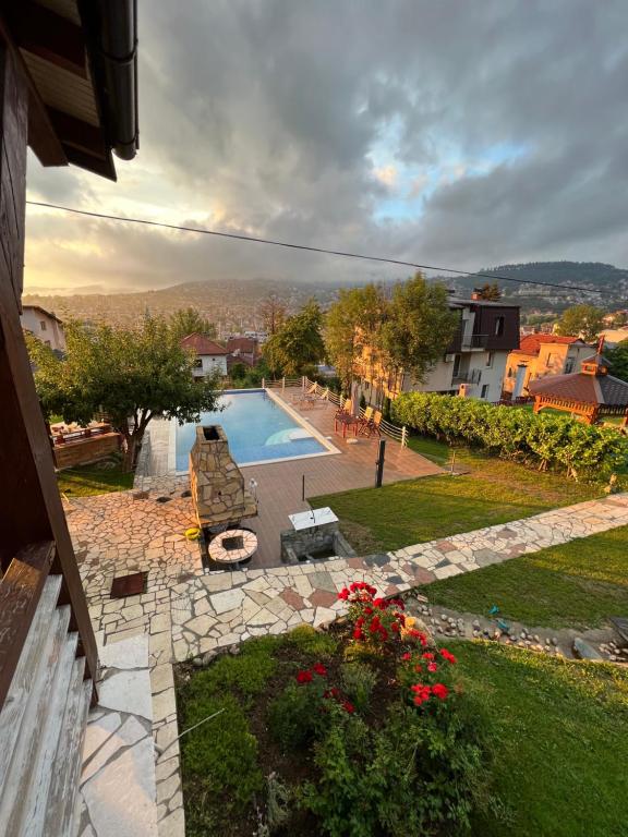 a view of a backyard with a swimming pool at Exclusive Apartments Bistrik in Sarajevo