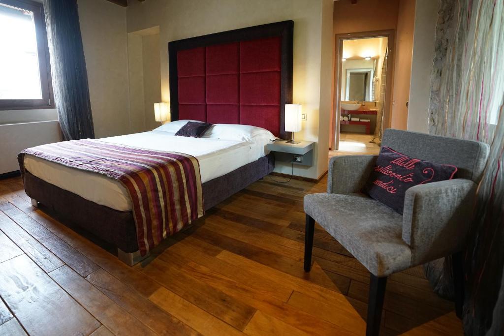 Postel nebo postele na pokoji v ubytování Il Portico - 1711 Luxury Guest House