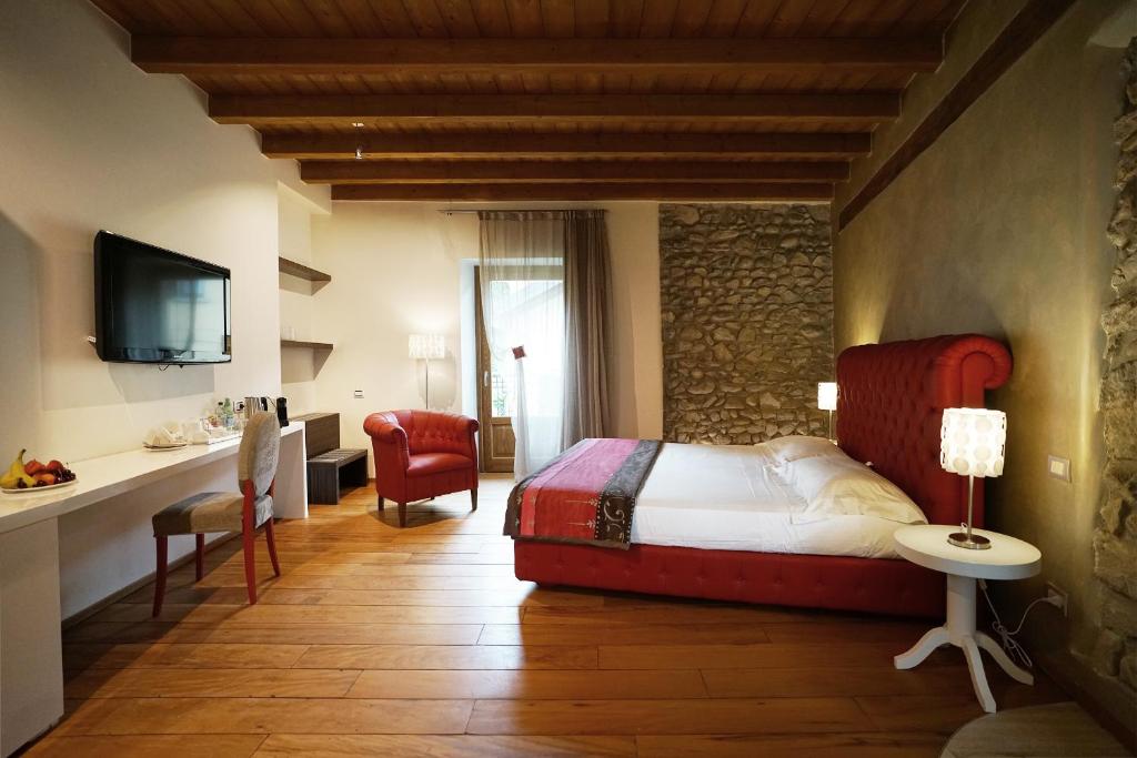 Postel nebo postele na pokoji v ubytování Il Portico - 1711 Luxury Guest House