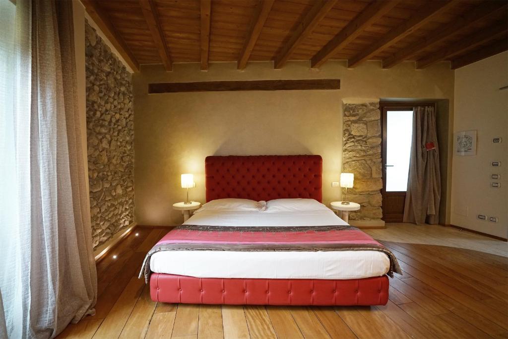 Postel nebo postele na pokoji v ubytování Il Portico - 1711 Luxury Guest House