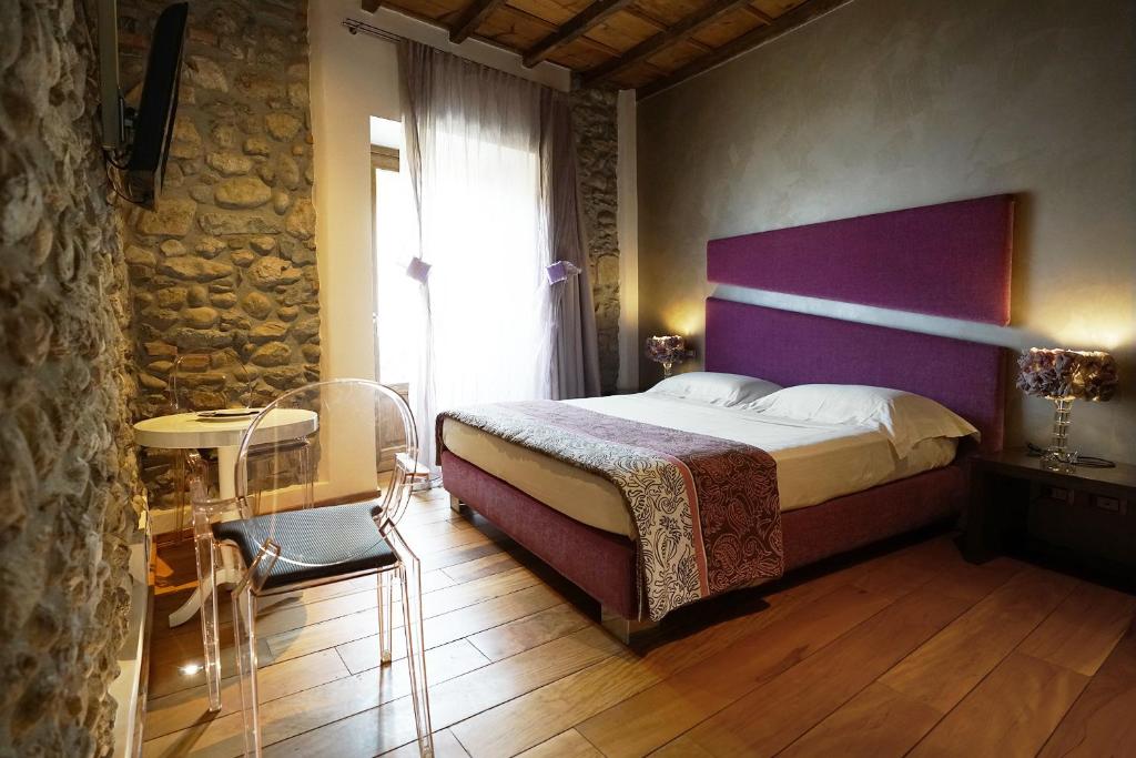 Postel nebo postele na pokoji v ubytování Il Portico - 1711 Luxury Guest House