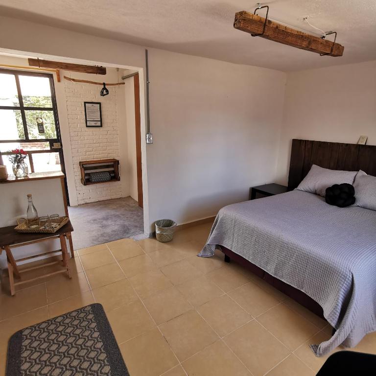 Postel nebo postele na pokoji v ubytování Finca del Pomar