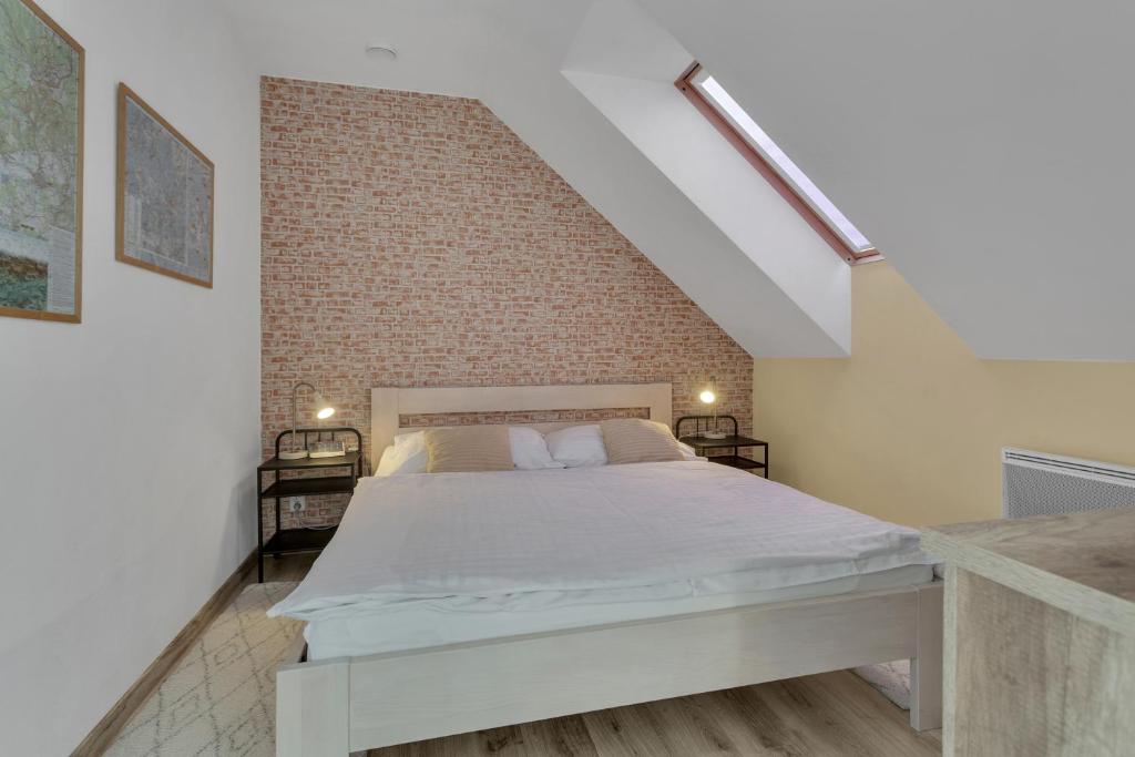 Postel nebo postele na pokoji v ubytování Family Apartments Klínovec