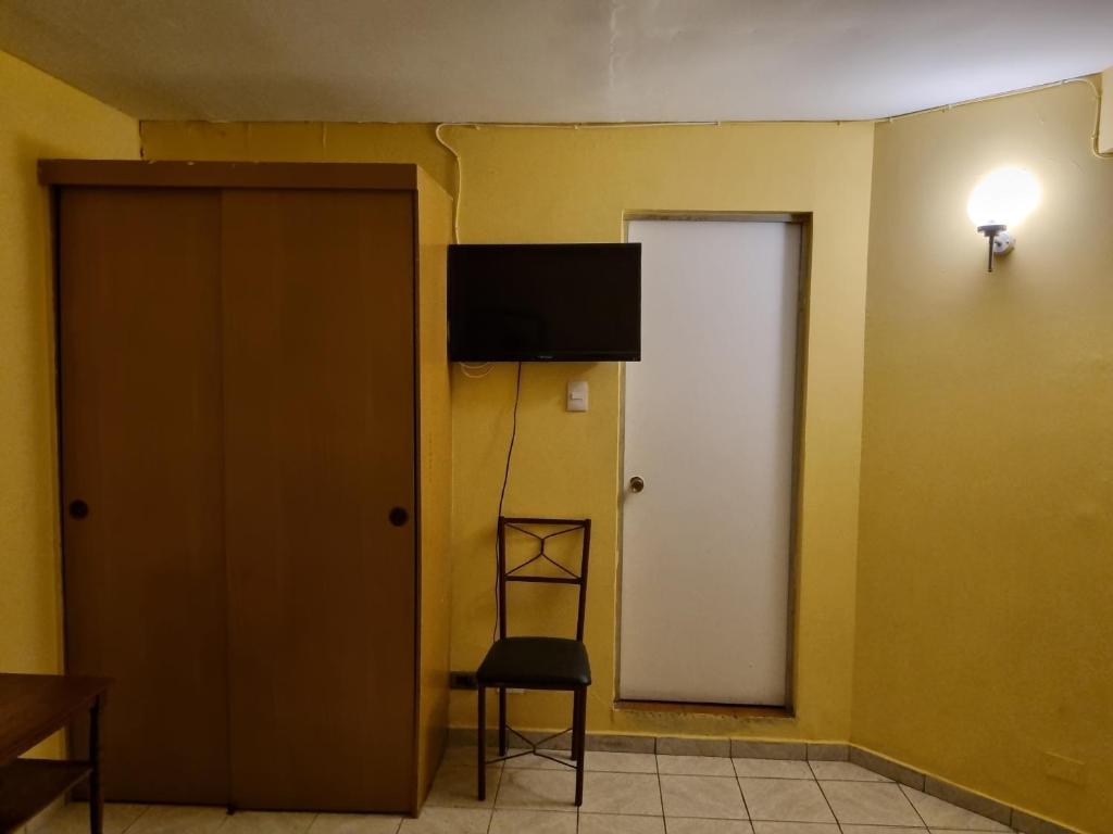 TV a/nebo společenská místnost v ubytování HOTEL ASTORE Matta 2537