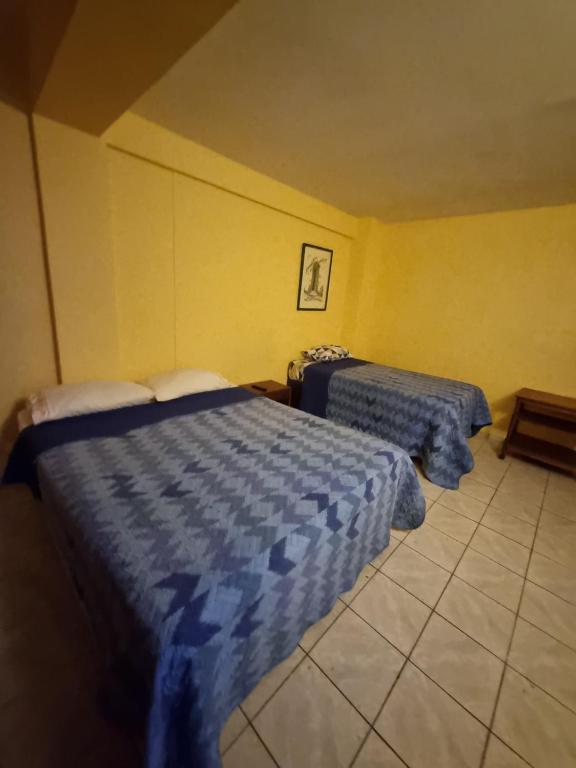 Postel nebo postele na pokoji v ubytování HOTEL ASTORE Matta 2537
