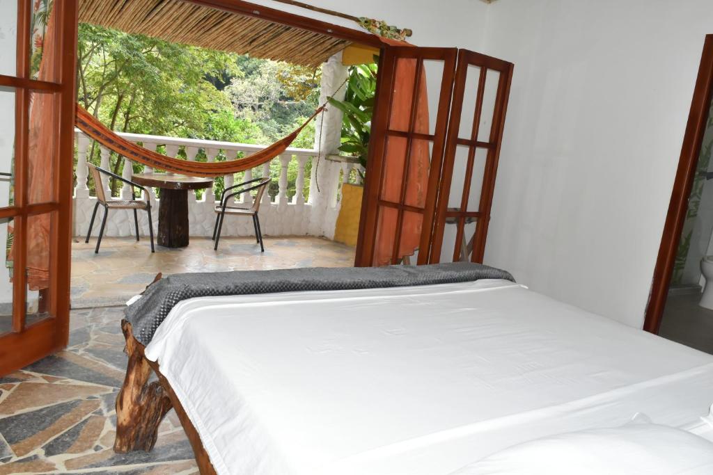 Ліжко або ліжка в номері Eco Hostal Kuima