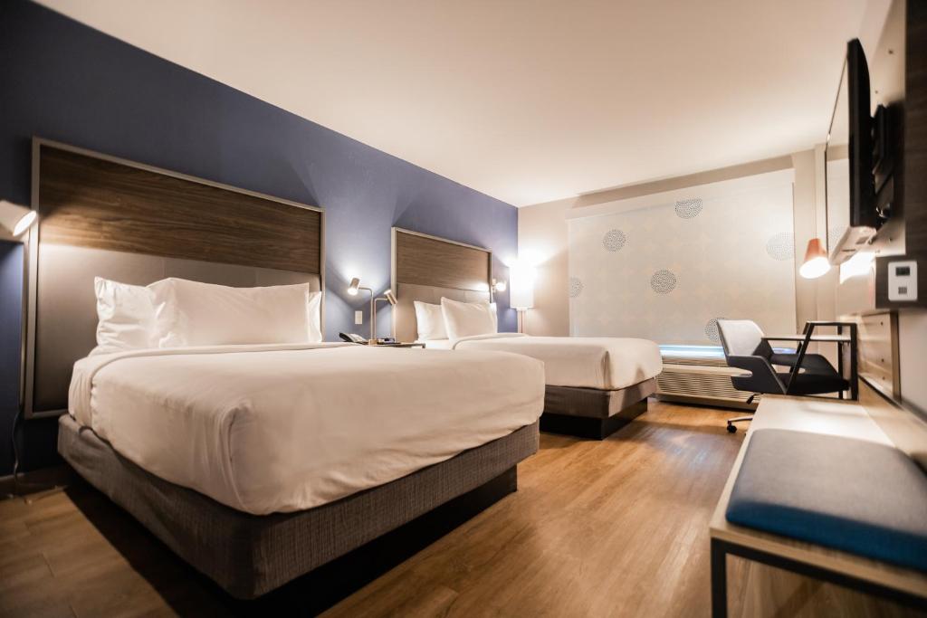 Uma cama ou camas num quarto em Tru By Hilton Yarmouth, Ns