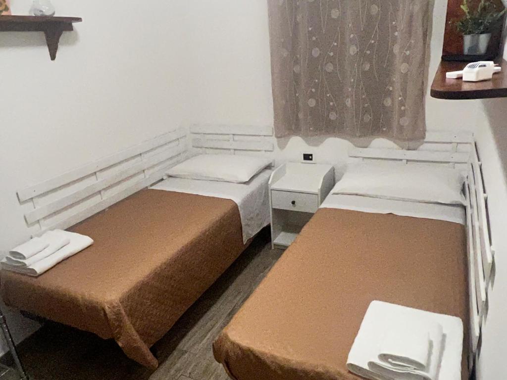 Postel nebo postele na pokoji v ubytování Summer Paradise