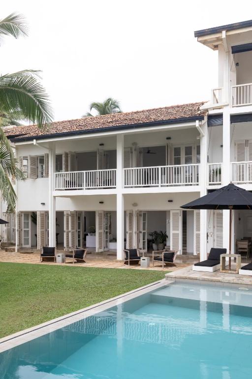 an exterior view of a resort with a swimming pool at Arabella on Boossa in Galle