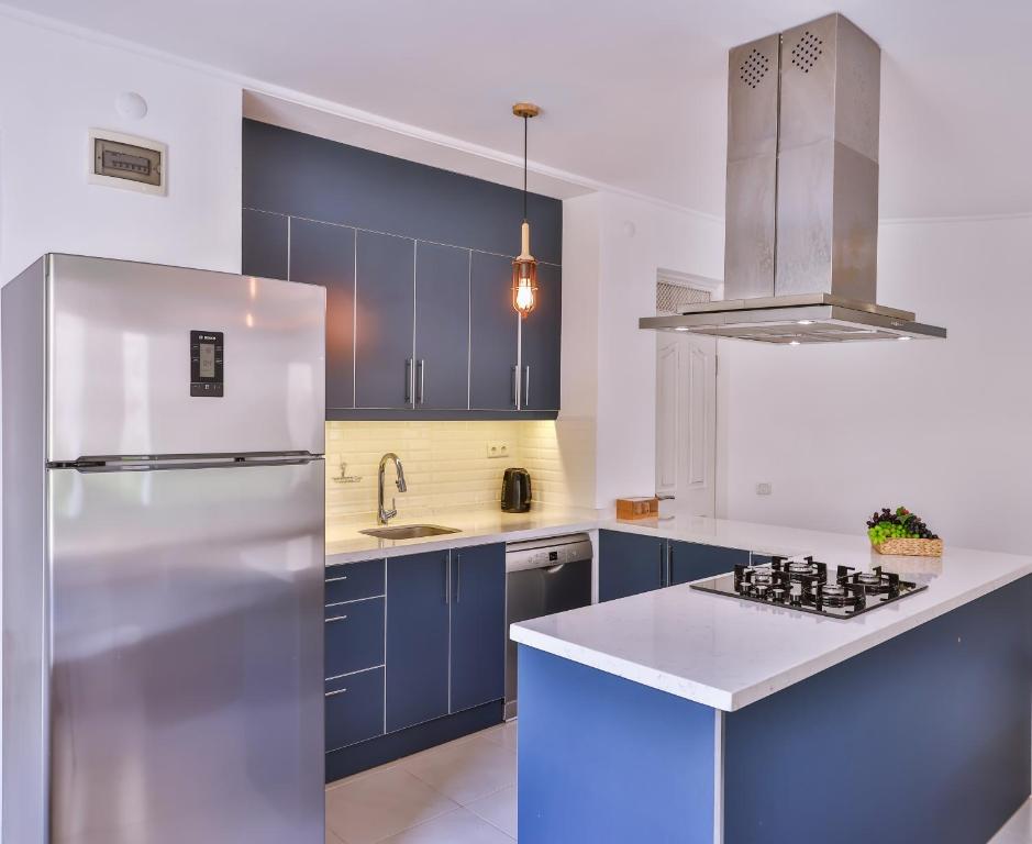 A kitchen or kitchenette at Villa Roxy 3 BR villa with one of the most unique gardens in Kalkan