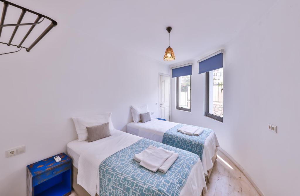 A bed or beds in a room at Villa Roxy 3 BR villa with one of the most unique gardens in Kalkan