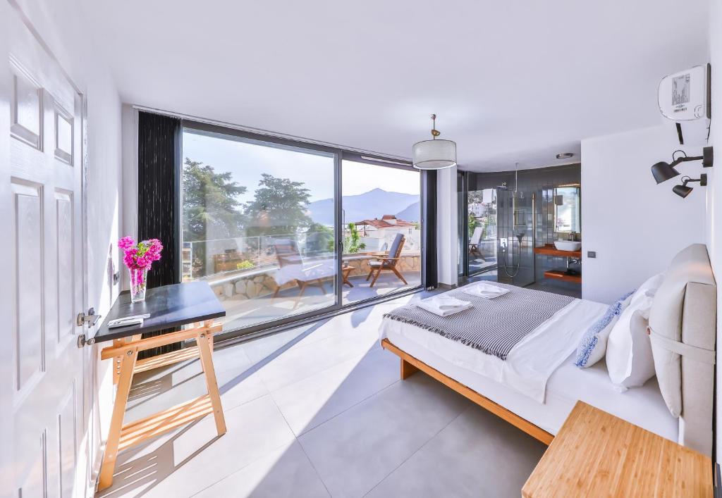 A bed or beds in a room at Villa Roxy 3 BR villa with one of the most unique gardens in Kalkan