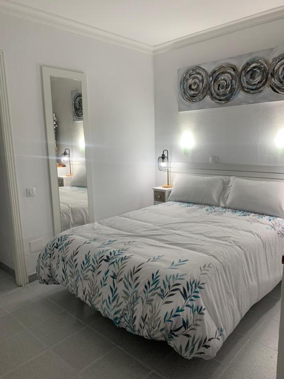 Llit o llits en una habitació de Apto Dowtown vistas piscina y cerca playa