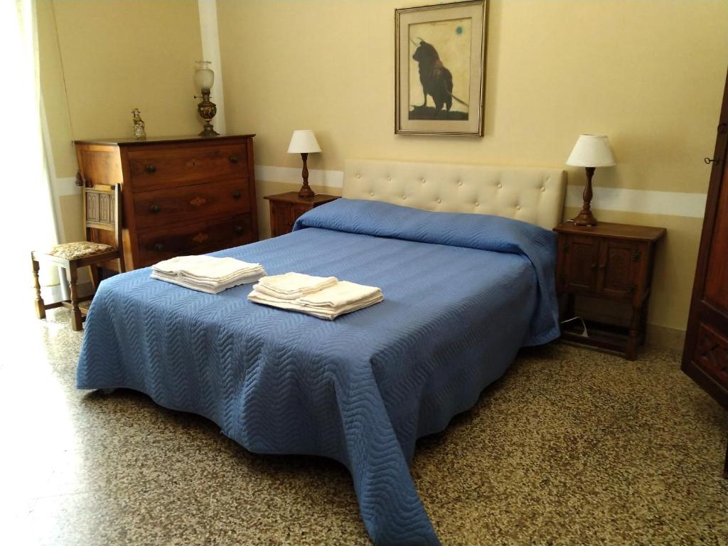 Postel nebo postele na pokoji v ubytování Il Genio del Porto - Mabbonath b&b