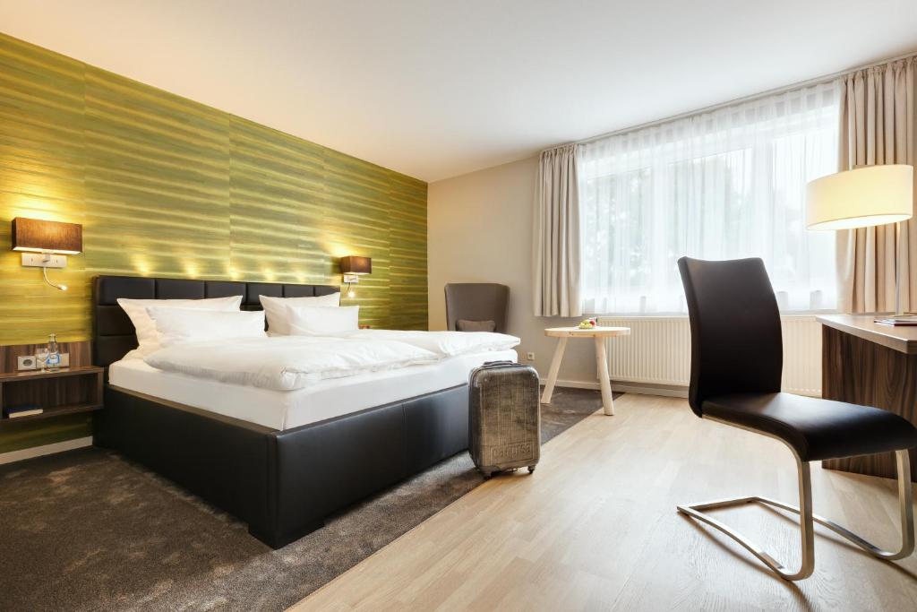 Postel nebo postele na pokoji v ubytování Hotel Hiemann - Superior