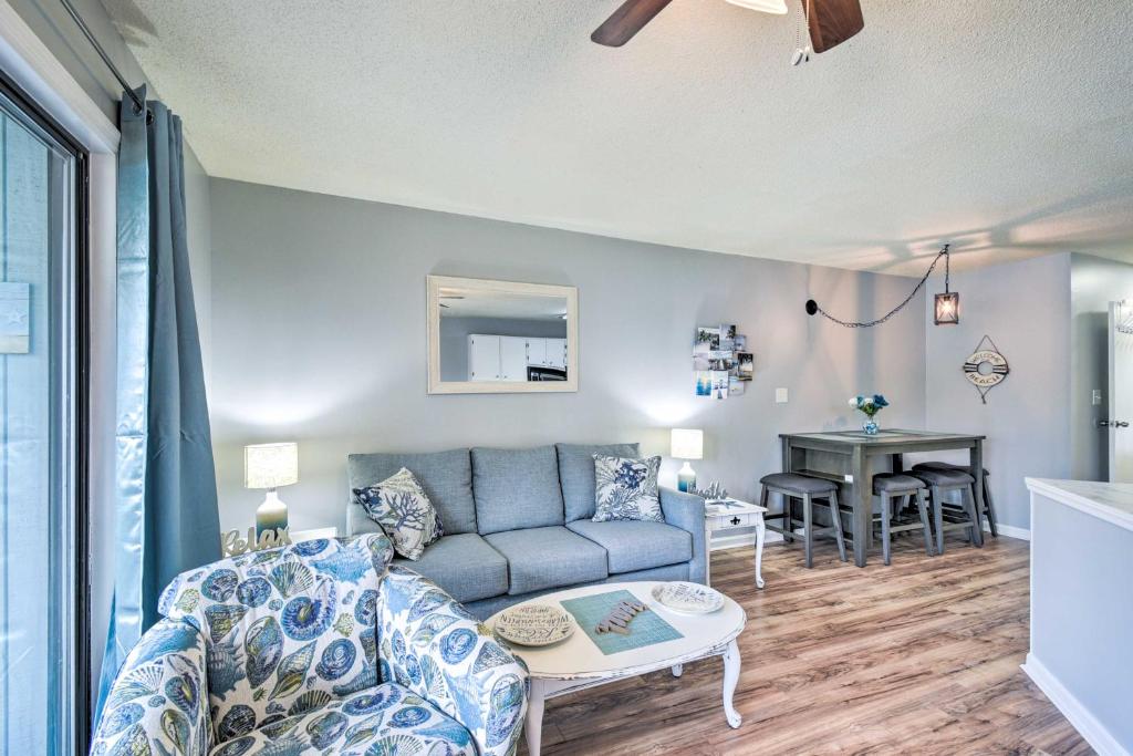 a living room with a couch and a table at Little River Condo with Pool about 3 Mi to Beach! in Little River