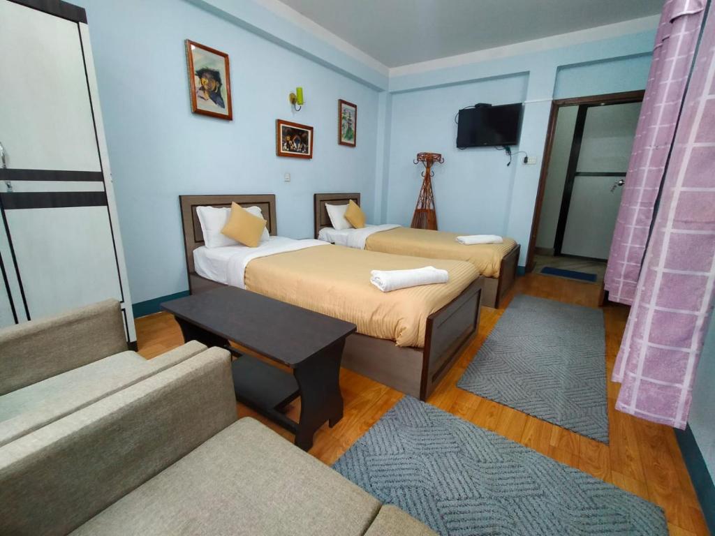 Postel nebo postele na pokoji v ubytování Hotel Pristine