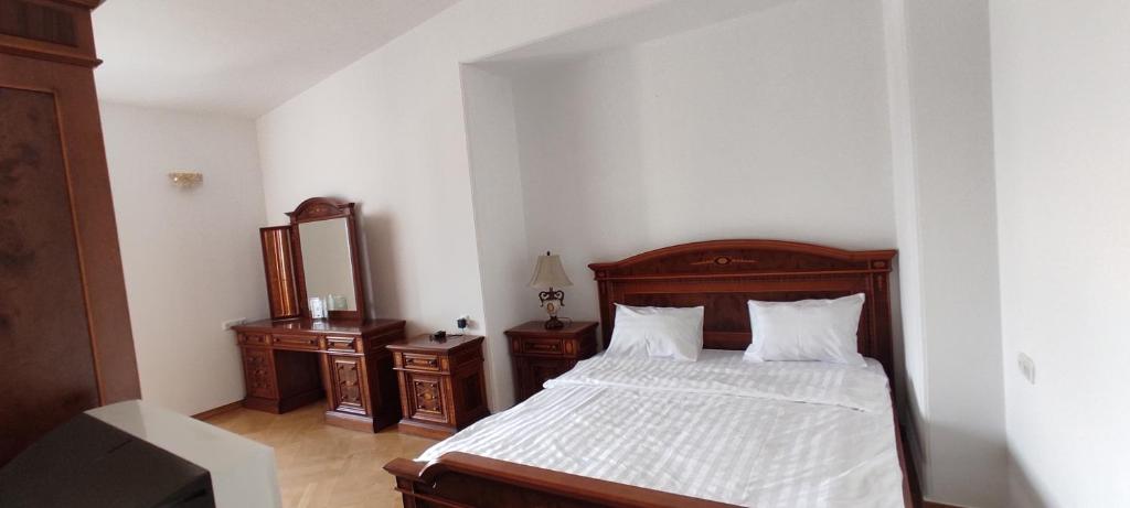 Postel nebo postele na pokoji v ubytování Roma Apartament