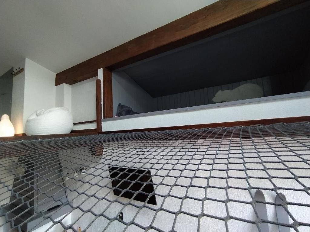 Voodi või voodid majutusasutuse Chalet Appart'Hôtel l'Eau Vive toas