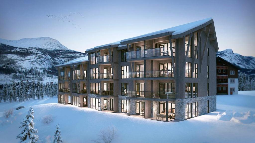 a rendering of a building in the snow at Snøya Lodge in Hemsedal