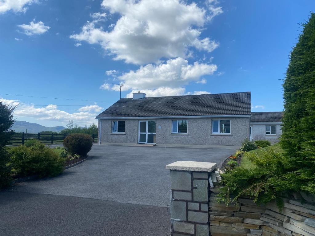 a house with a driveway in front of it at Sandfield View in Ardara