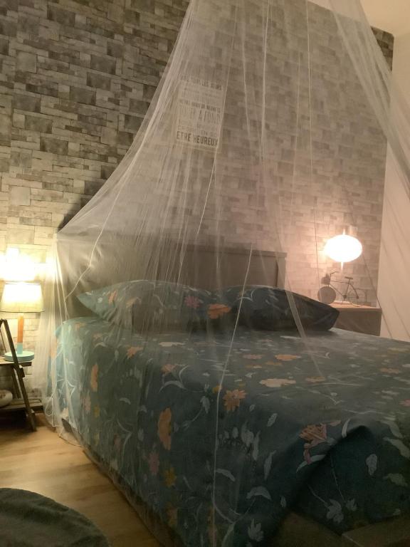 Postel nebo postele na pokoji v ubytování Un séjour entre Nîmes et Montpellier