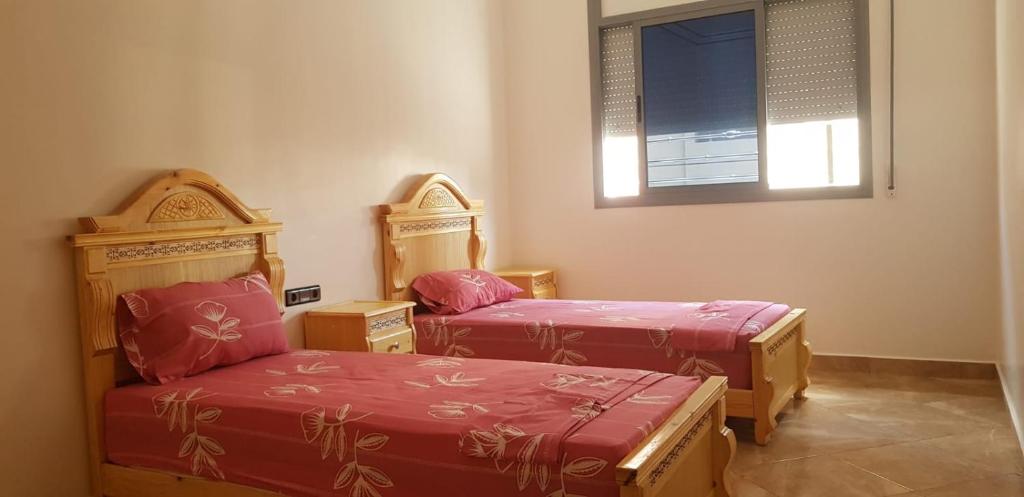 Postel nebo postele na pokoji v ubytování appartement boukidan