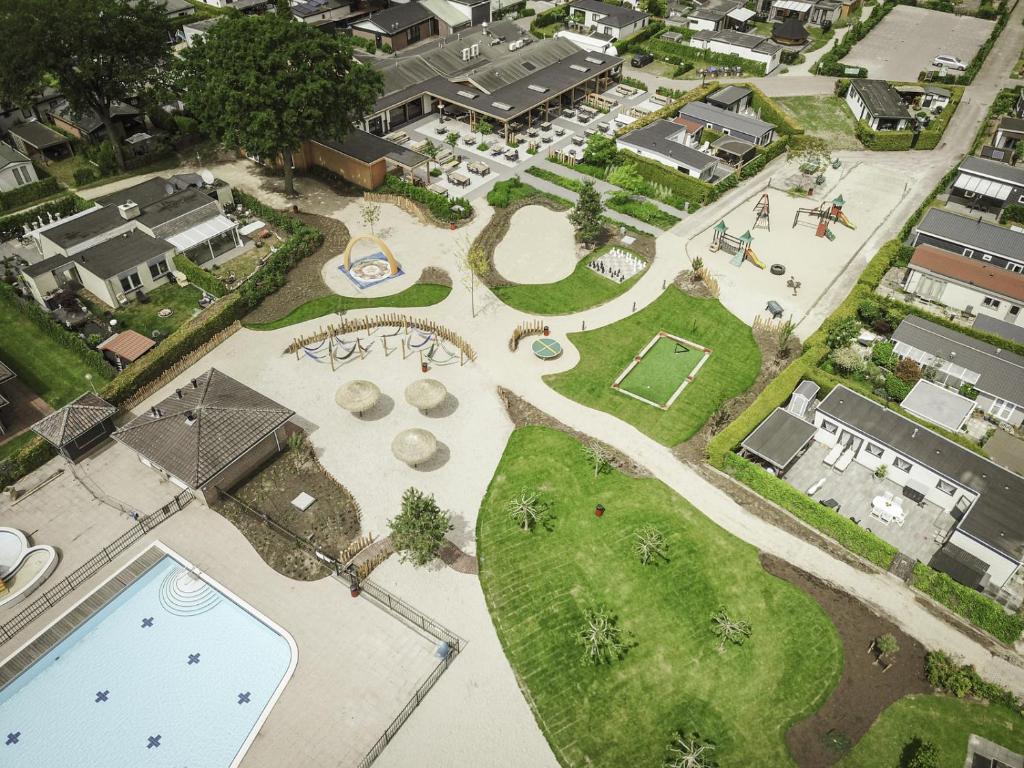 an aerial view of a park with a pool at Recreatiepark de Boshoek in Voorthuizen