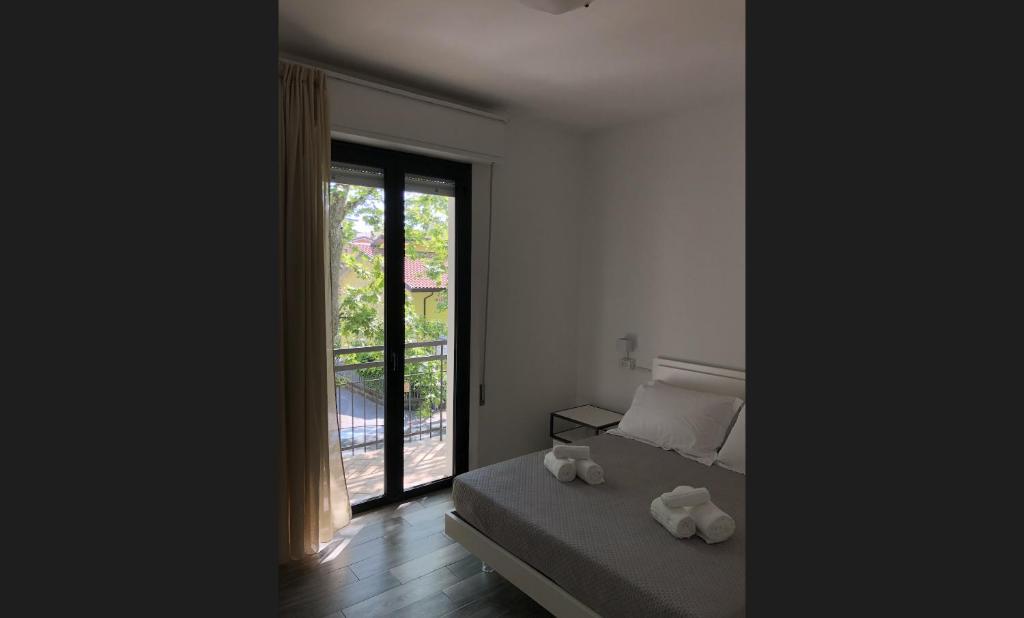 Postel nebo postele na pokoji v ubytování Vinsea Hotel