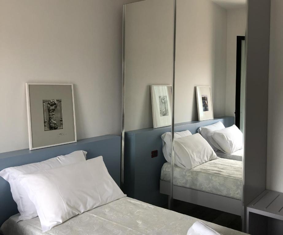 Postel nebo postele na pokoji v ubytování Vinsea Hotel