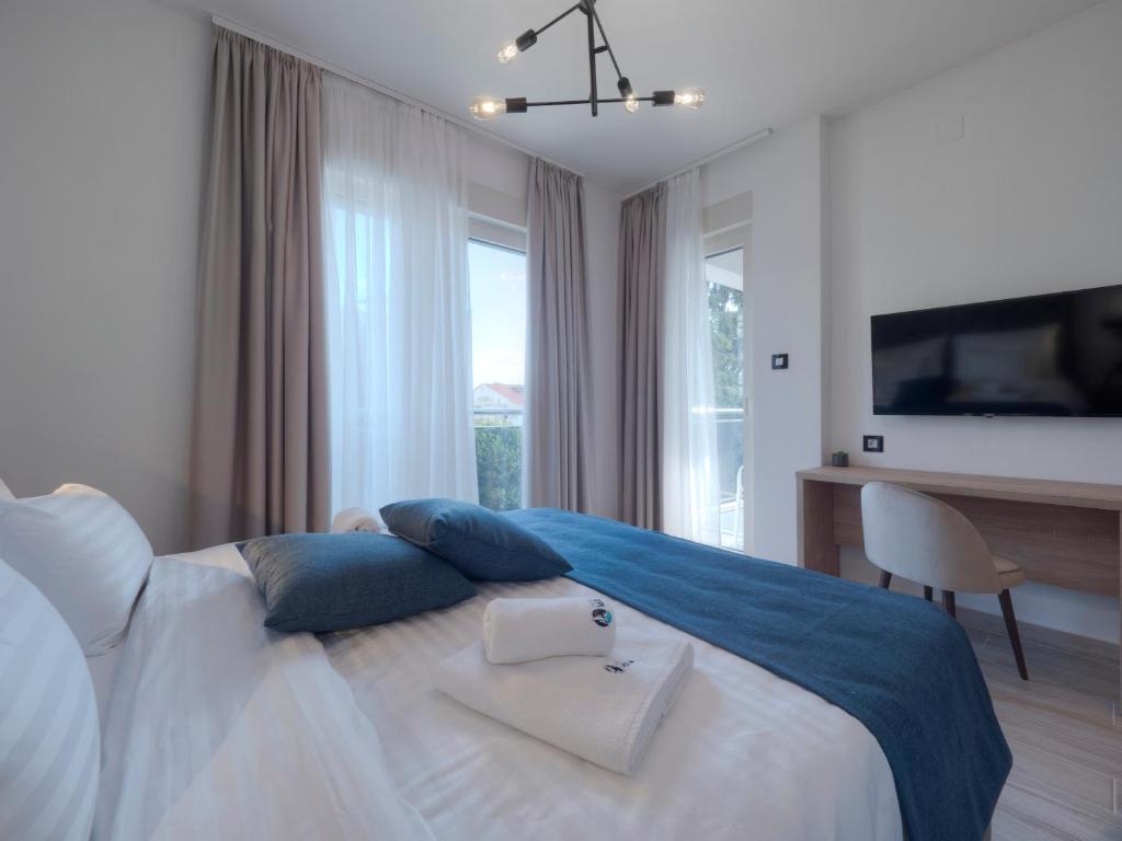 Postel nebo postele na pokoji v ubytování Hotel Idila Budva