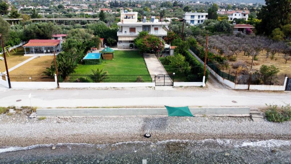 an aerial view of a house with a yard at Meliades Villa in Agioi Theodoroi