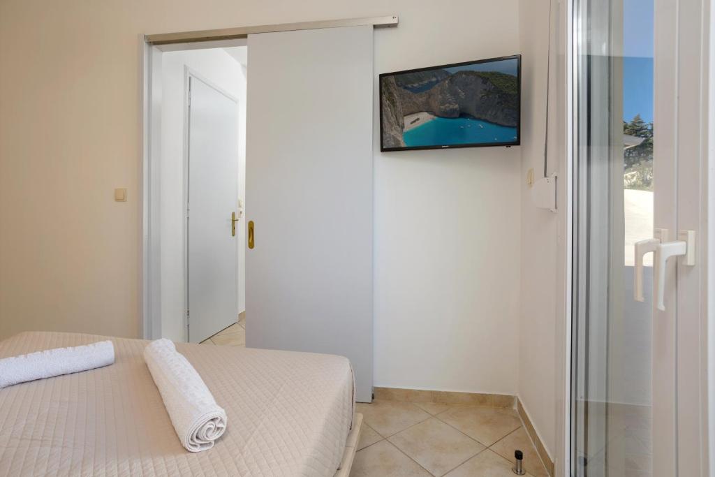 Posteľ alebo postele v izbe v ubytovaní Icabaru Zante Holiday House