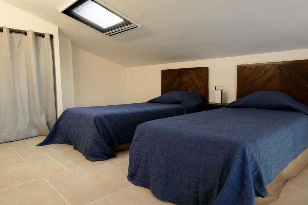 Posteľ alebo postele v izbe v ubytovaní VILLA CAREMEAU 2