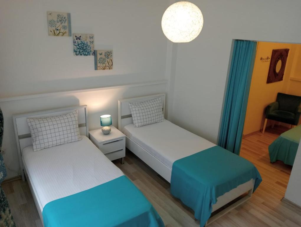 Postel nebo postele na pokoji v ubytování Daffne Otel