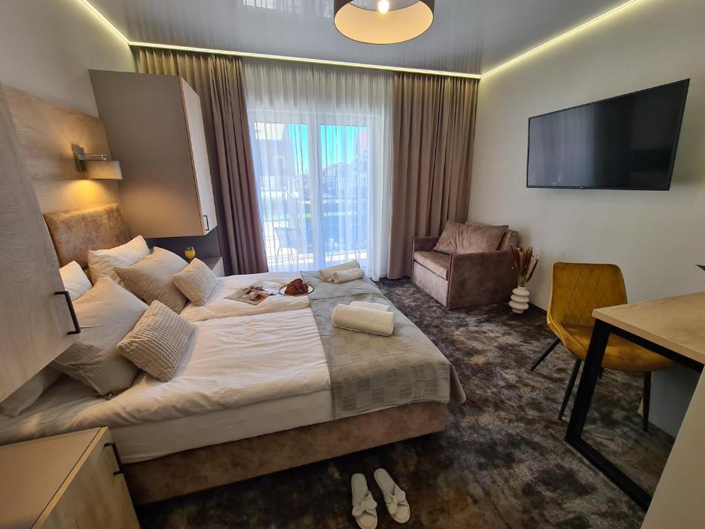 Postel nebo postele na pokoji v ubytování BALTIC RESIDENCE