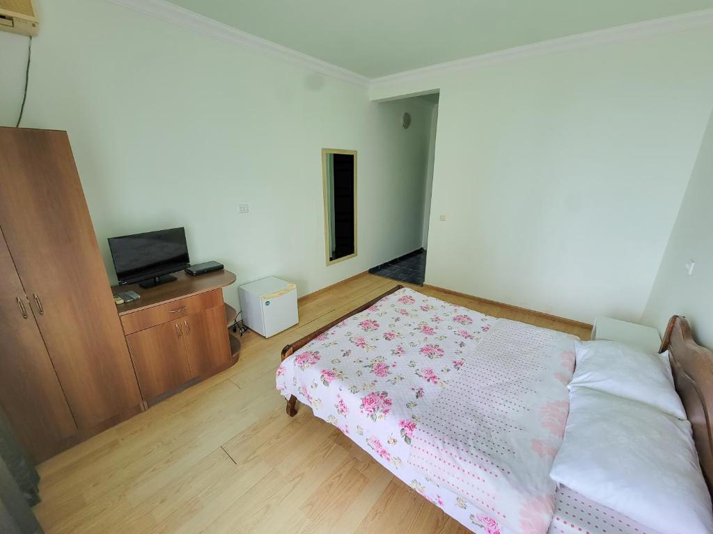Postel nebo postele na pokoji v ubytování Kvariati Residence